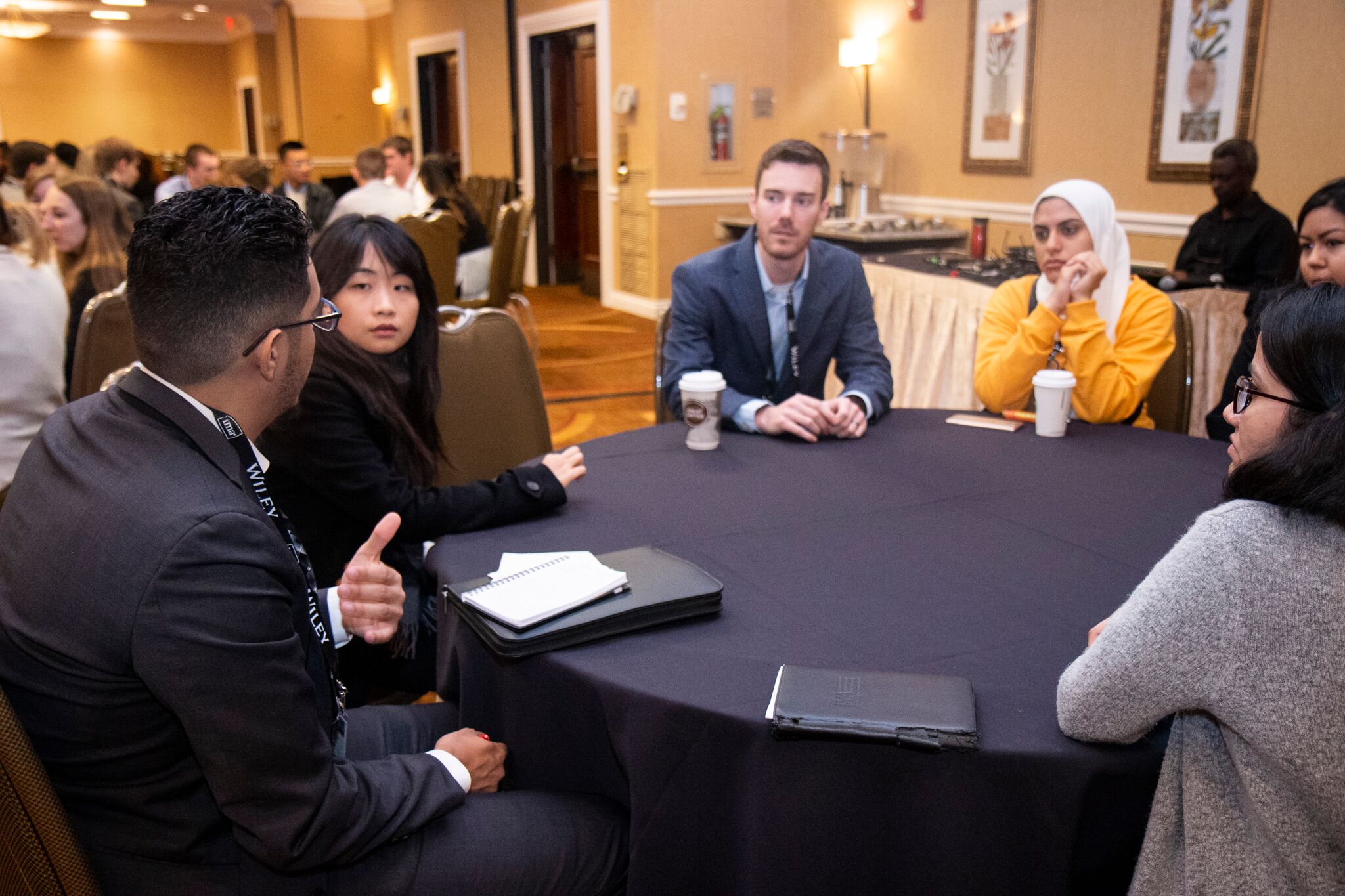A group of people having a discussion at a table