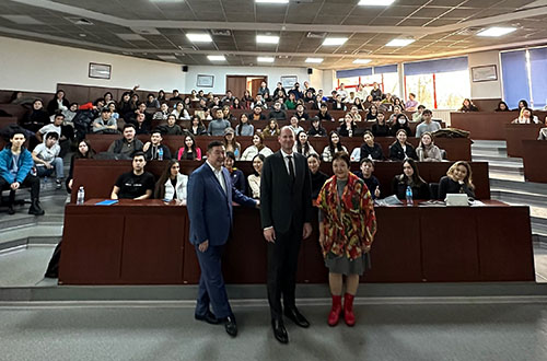 A group of people in a conference room at the Kazakhstan Chapter event