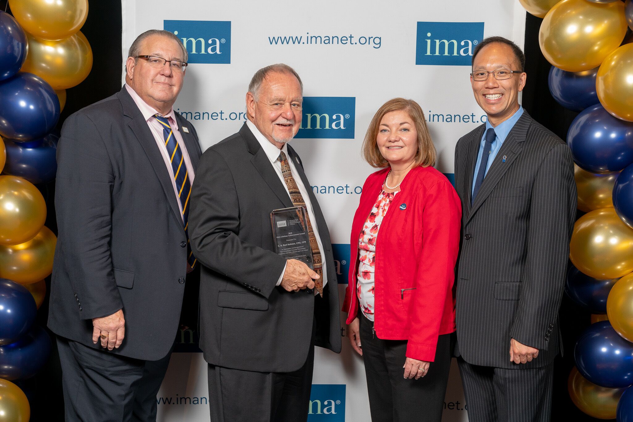 Bud Kulesza receives this year?s Lifetime Achievement Award. Pictured, from l. to r., Marc Palker, IMA Chair-Emeritus; Kulesza; Ginger White, IMA Chair-Elect; and Alex Eng, IMA Chair.