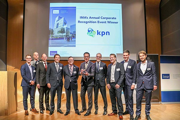 Executives from Royal KPN receive the company?s 2018 Corporate Recognition Award from IMA.