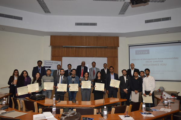 At a chapter meeting in Delhi, new CMAs proudly display their certificates.