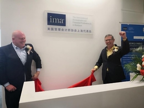 Piechowski (l.) and Thomson celebrate the opening of IMA?s newest office in Chengdu.