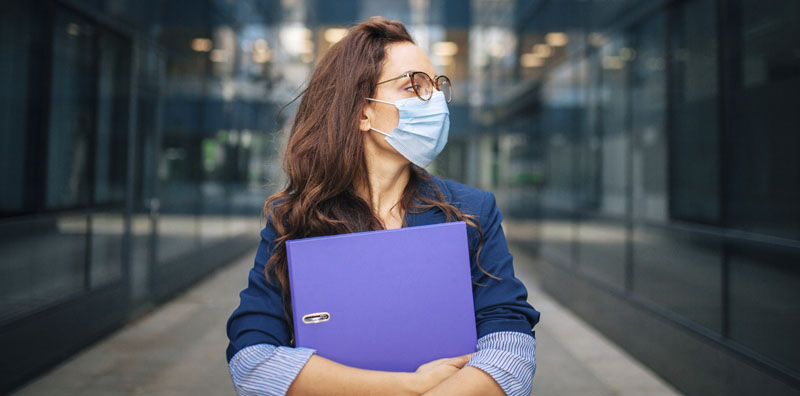 Woman wearing  a mask to protect from COVID-19