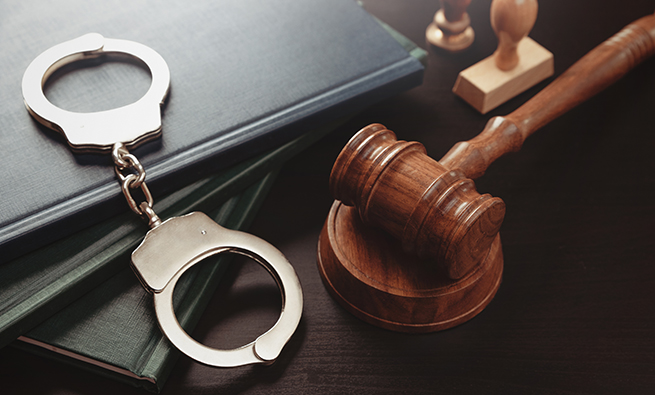 image of a handcuffs and gavel