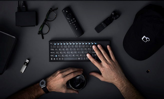 image of hands and a keyboard on the table