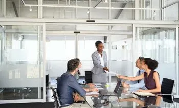 Four people having a meeting