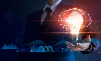 A person holding a light bulb