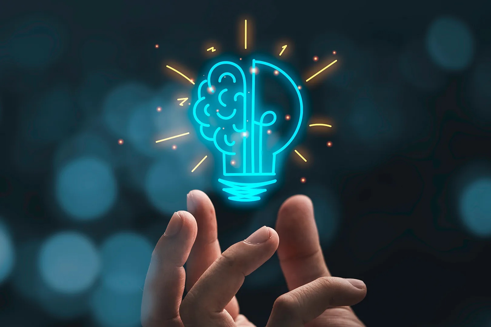 A hand holding a stylized light bulb